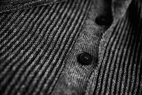 Photo shows close up of thread spun on jumper.